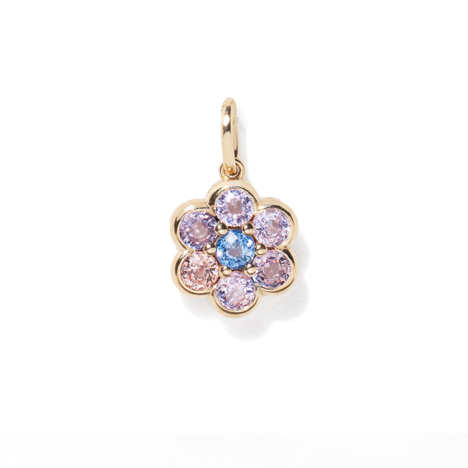 Gold pendant with multicolored gemstones on a white background