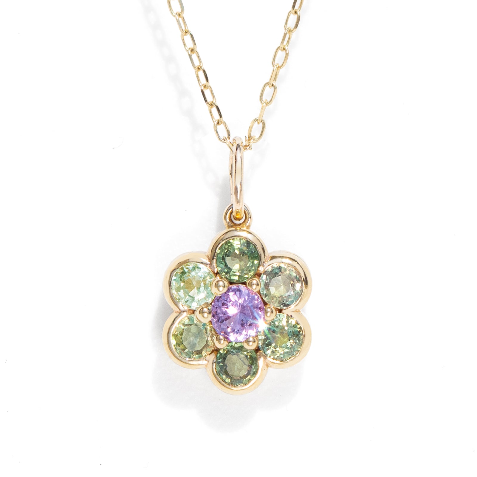 Green and purple natural sapphire floral charm necklace pendant in gold.