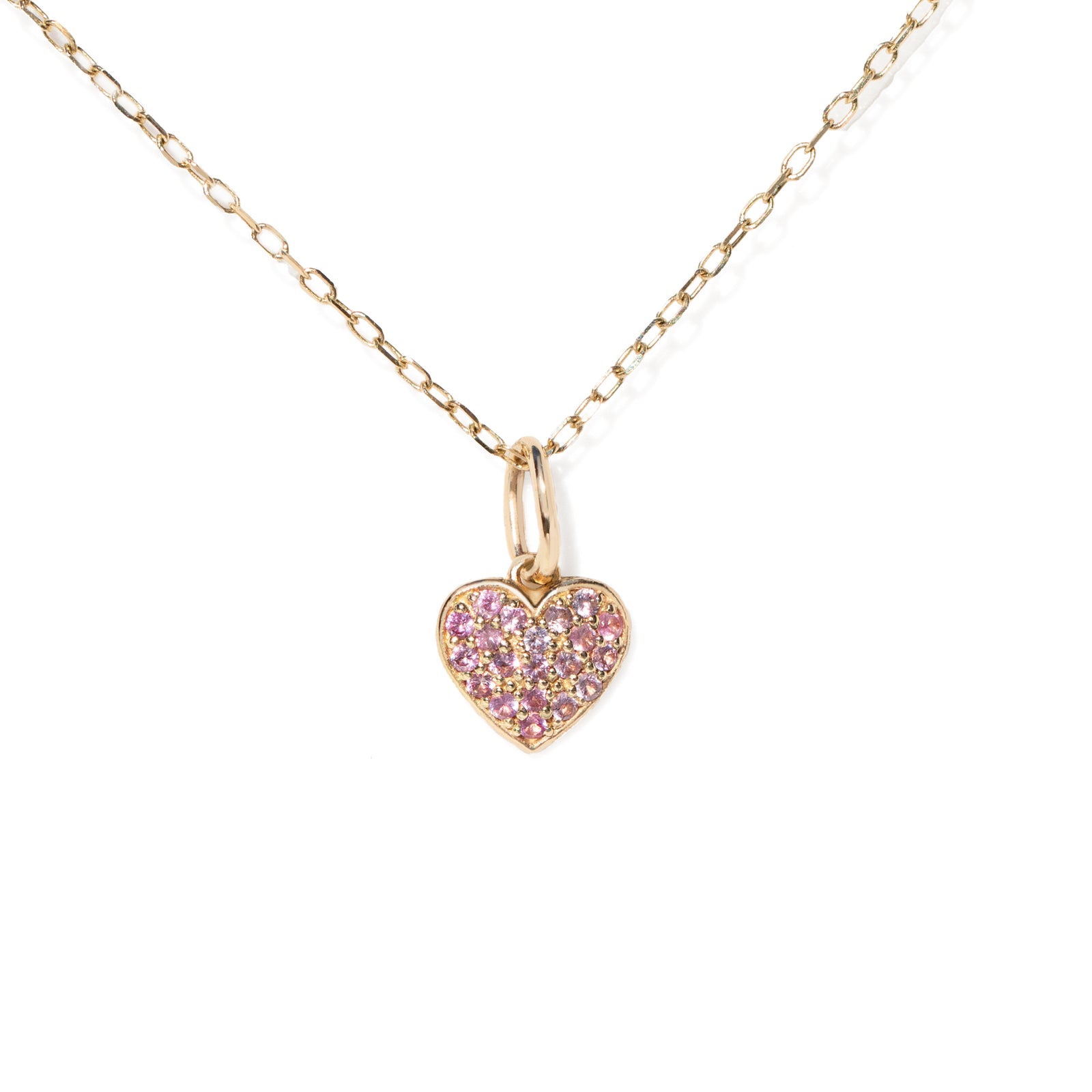 Heart-shaped pink gemstone pendant on a gold chain against a white background