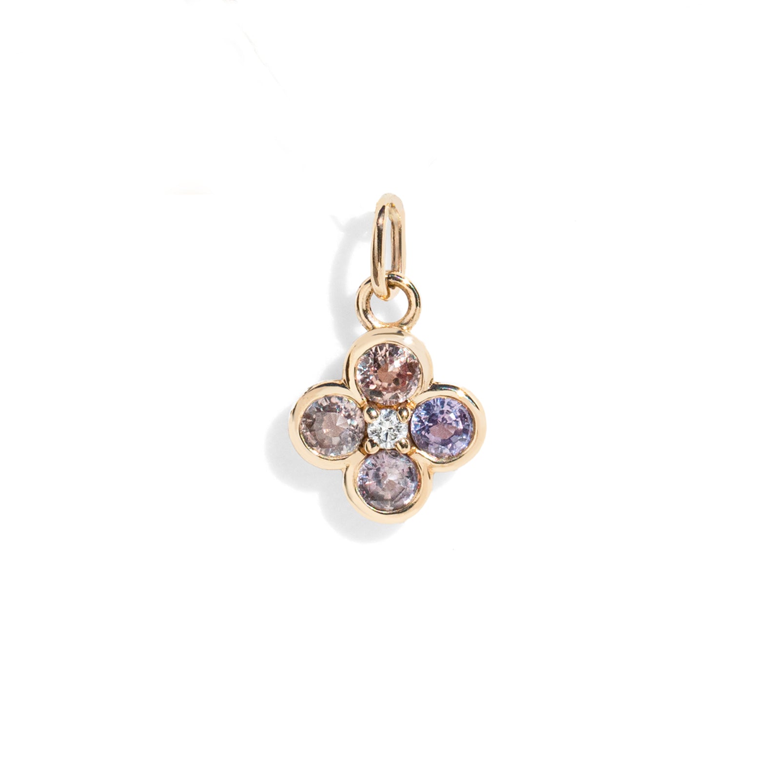 Gold necklace with a four-leaf clover pendant featuring multicolored gemstones on a white background.