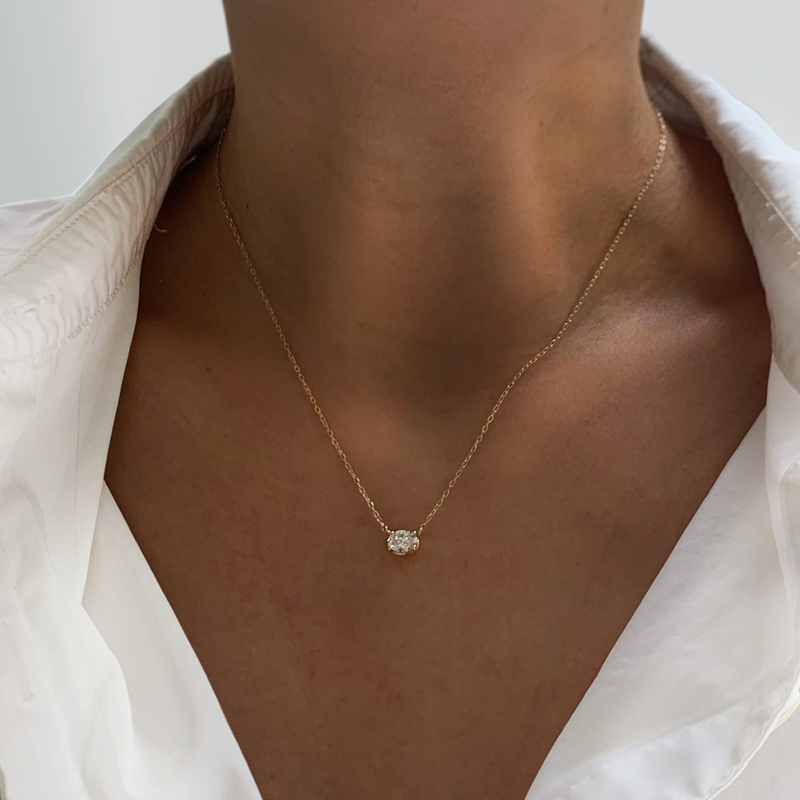 Jamie Park Oval Diamond Solitaire Necklace This Oval Diamond Solitaire Necklace features a sparkling lab diamond, set in a classic four prong design. With each diamond certified by IGI, this necklace makes for a timeless and cherished gift, perfect for any special occasion. Add a touch of elegance to any outfit with this beautiful piece. Chain length 16-18" 