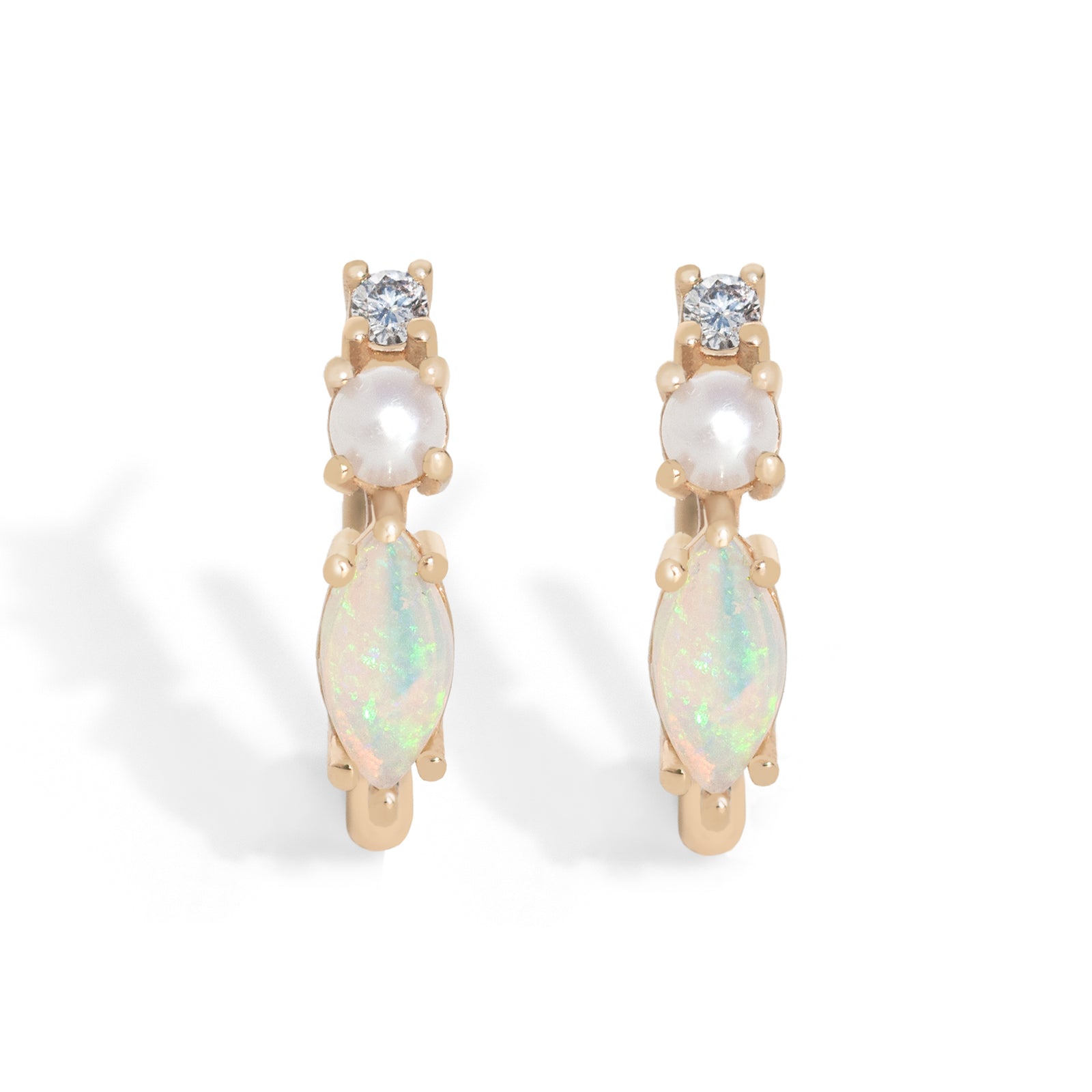 Inspired by our bestselling ring, these 14K gold hoops feature marquise-cut natural Australian opals, freshwater pearls, and natural diamonds – the perfect balance of uniqueness and simplicity for everyday wear. 