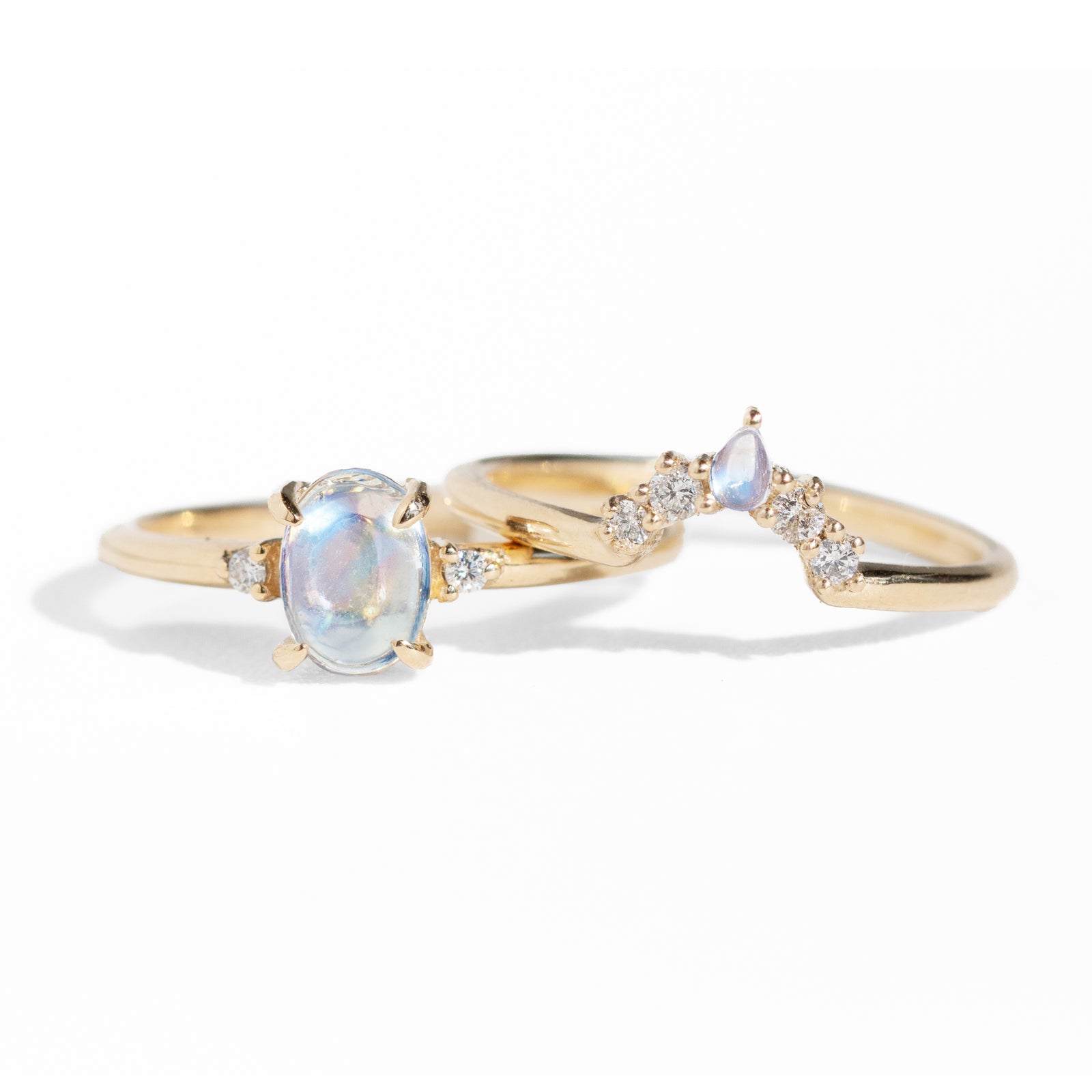 The classic Grace Ring's three stone design makes it perfect for your special day. This unique ring features an oval rainbow moonstone adorned with small diamonds, making it a truly one-of-a-kind piece. Pair this ring with Blossom Moonstone Contour Band to create your dream ring stack. 