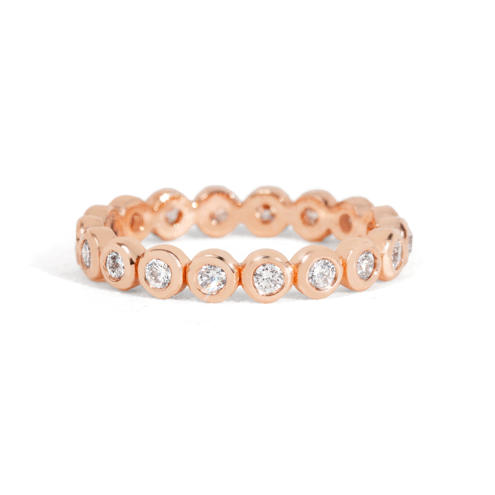 Gold ring with embedded diamonds on a white background