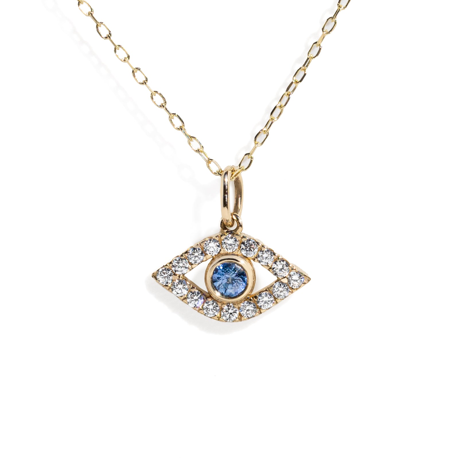Gold necklace with an eye-shaped pendant featuring a blue gemstone on a white background