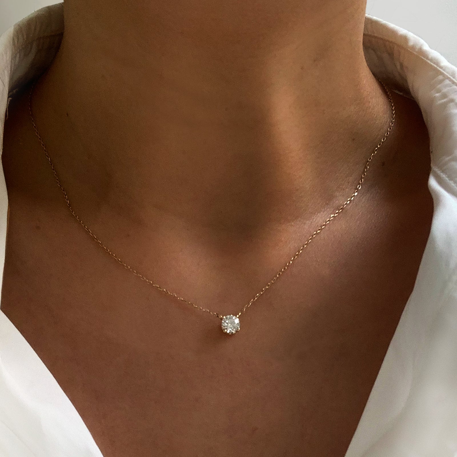 Jamie Park Jewelry - Round Diamond Solitaire Necklace This Round Diamond Solitaire Necklace features a sparkling lab diamond, set in a classic four prong design. With each diamond certified by IGI, this necklace makes for a timeless and cherished gift, perfect for any special occasion. Add a touch of elegance to any outfit with this beautiful piece. Chain length 16-18" 