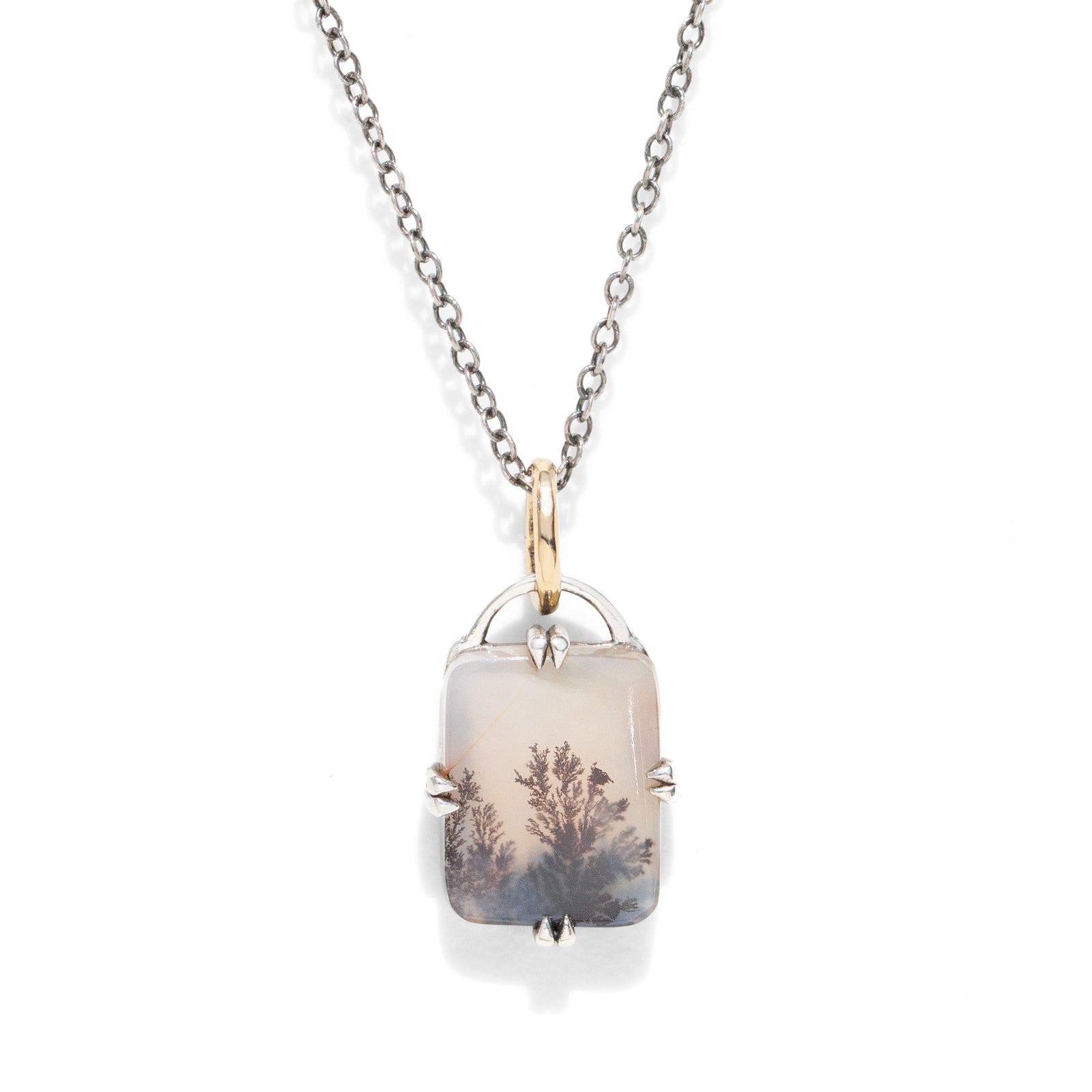 A gemstone necklace on a black chain