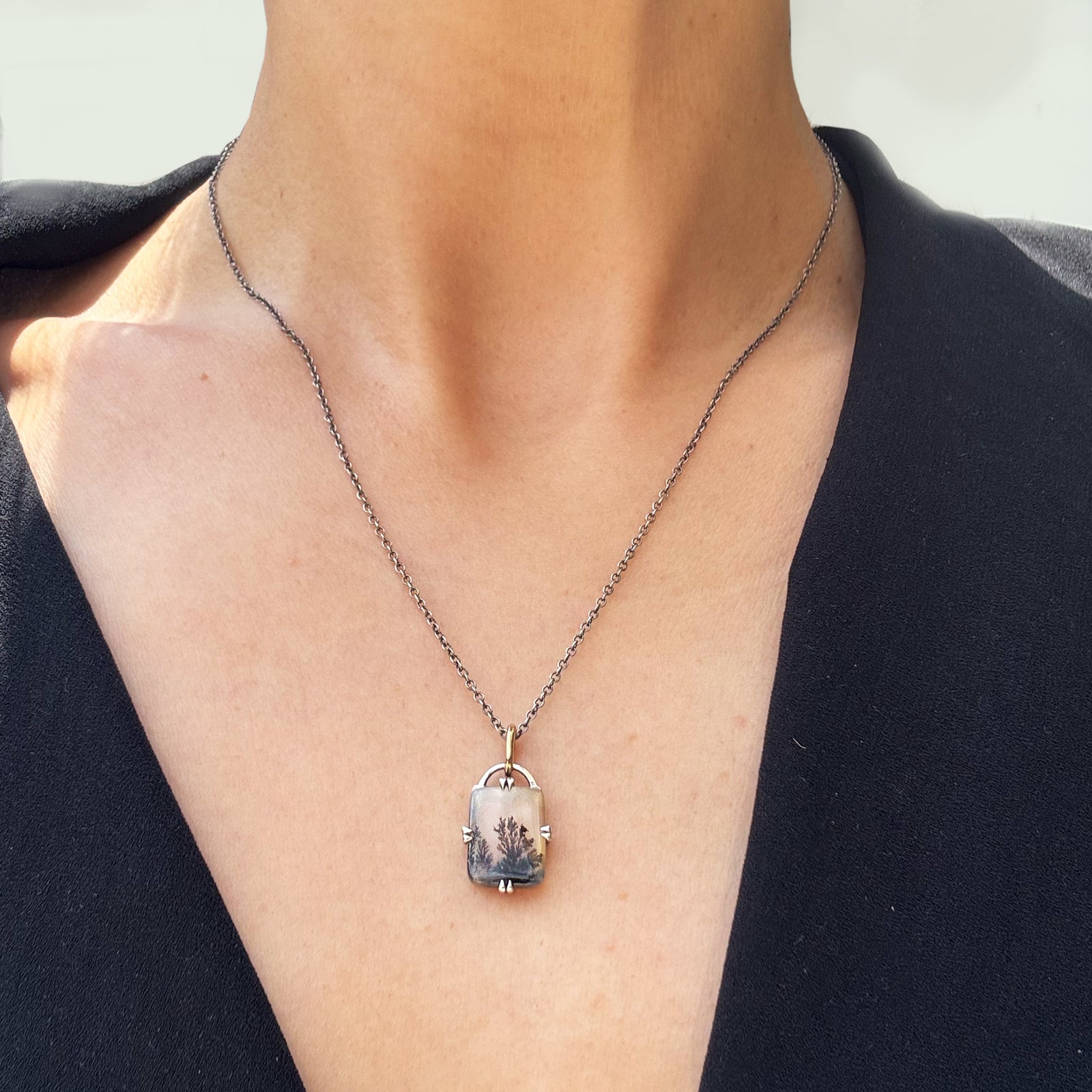 gemstone necklace on a woman's neck