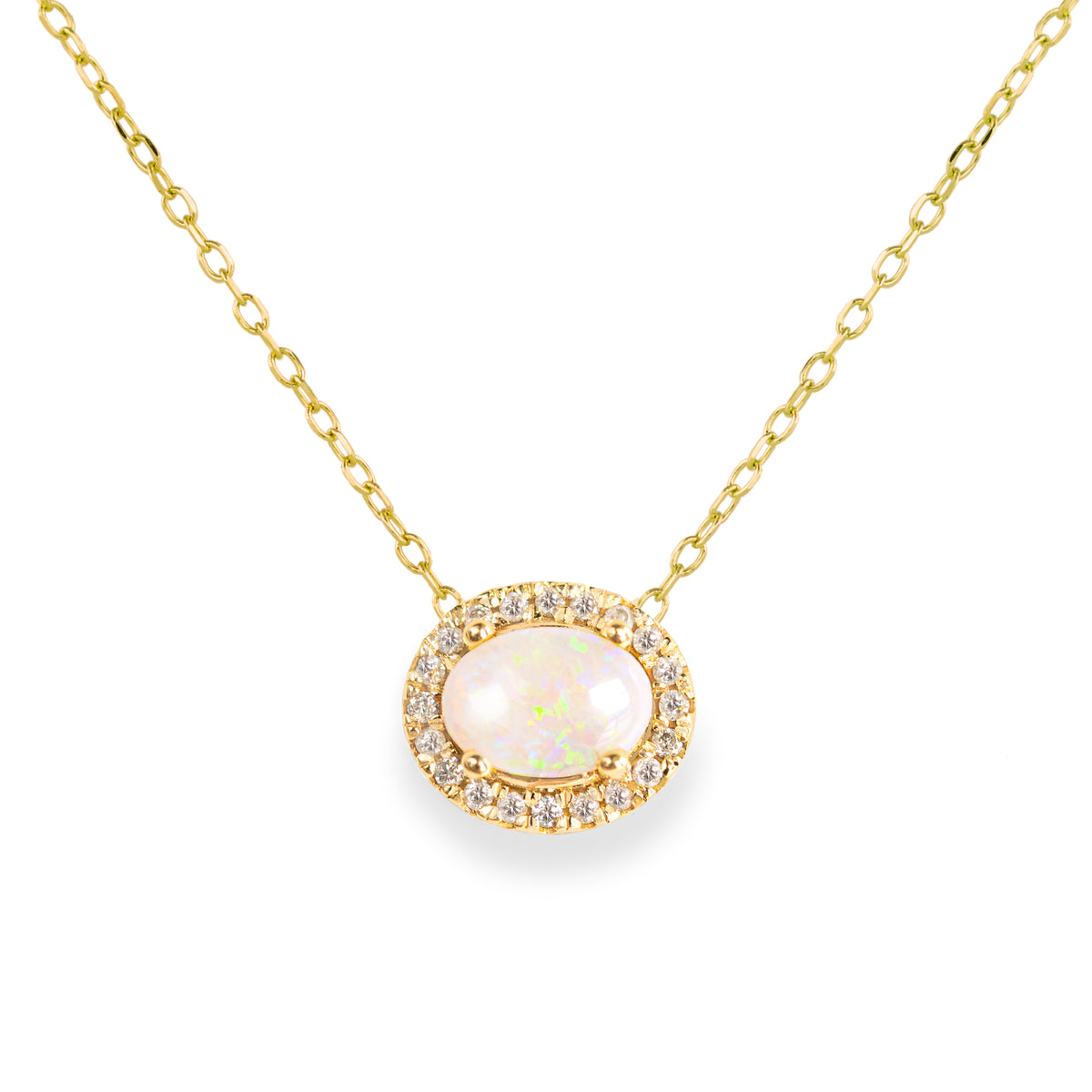 Jamie Park Jewelry -Opal Diamond Halo Necklace This necklace is the epitome of luxury, featuring an oval Australian opal surrounded by a radiant halo of natural diamonds. A symbol of hope and purity, it makes the perfect gift for any special occasion.