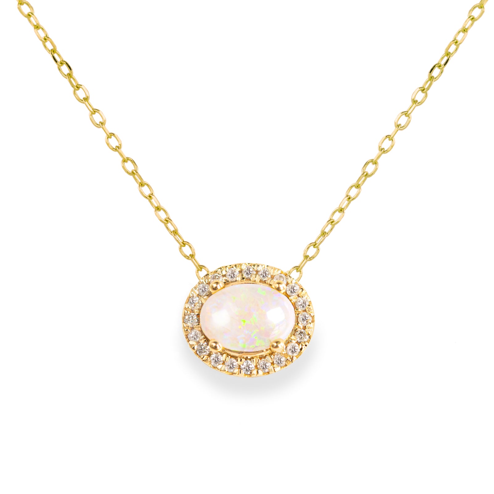 Jamie Park Jewelry -Opal Diamond Halo Necklace This necklace is the epitome of luxury, featuring an oval Australian opal surrounded by a radiant halo of natural diamonds. A symbol of hope and purity, it makes the perfect gift for any special occasion.
