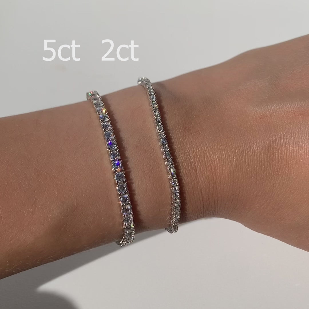 This tennis bracelet is crafted with dazzling lab or natural diamonds, making it luxurious yet minimalistic fine jewelry for any occasion. Its timeless design and movement will be sure to make heads turn. A perfect gift to someone special or yourself. Model is wearing 2CT.