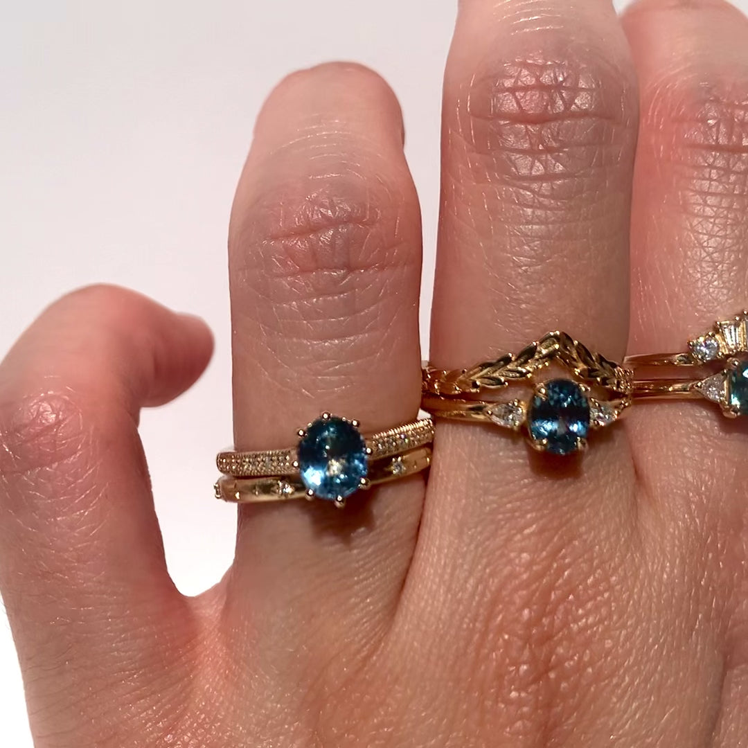 The 1.3ct. Oval Montana Sapphire Audrey Ring features a rich blue-green Montana sapphire on a band with delicate milgrain detailing. The elegant 8-prong design securely holds your stone, adding a unique touch. This ring is perfect for those who love timeless and intricate design. 