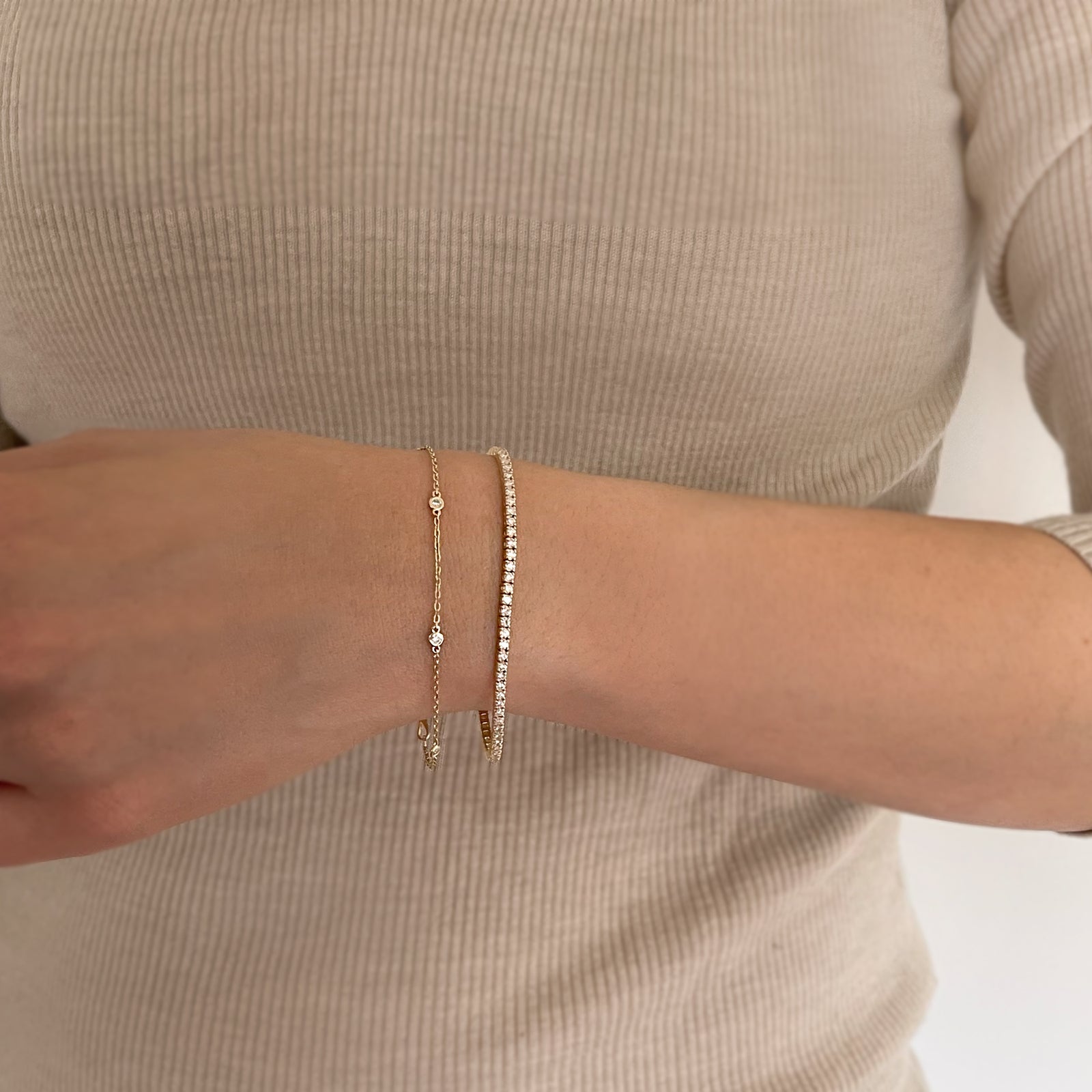 This tennis bracelet is crafted with dazzling lab or natural diamonds, making it luxurious yet minimalistic fine jewelry for any occasion. Its timeless design and movement will be sure to make heads turn. A perfect gift to someone special or yourself. Model is wearing 2CT.
