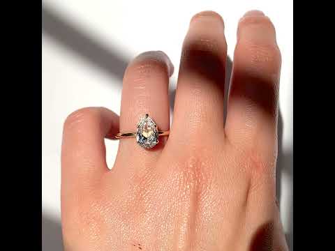 Jamie Park Jewelry - 2ct Pear Cut Lab Diamond Ring Jamie Park Jewelry | Sunshine Pear Cut Ring The Sunshine Pear Cut Solitaire Ring beautifully blends modern style with elegance. Available with lab white sapphire, moissanite, or IGI certified diamond, this ring is sure to sparkle and impress. The five-prong design ensures the center stone is securely held. The size shown is 2.5ct.