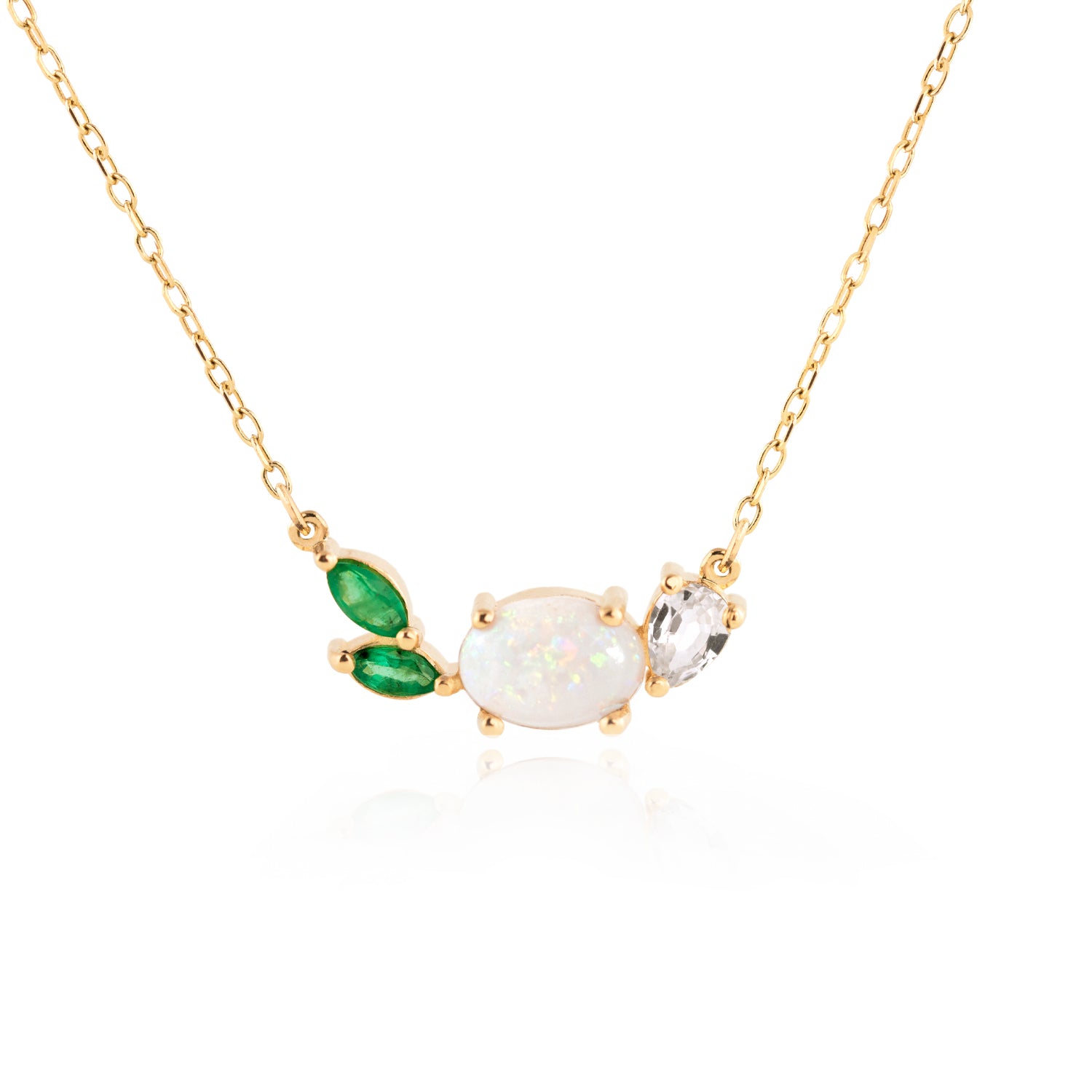 Opal Emerald Necklace by Jamie Park Jewelry This beautiful, 14K gold-cast necklace is inspired by the tranquility of a lush evergreen. Adorned with a cluster of gorgeous gemstones, including an Australian opal and two emeralds, it's finished with a sparkly pear-cut lab diamond.