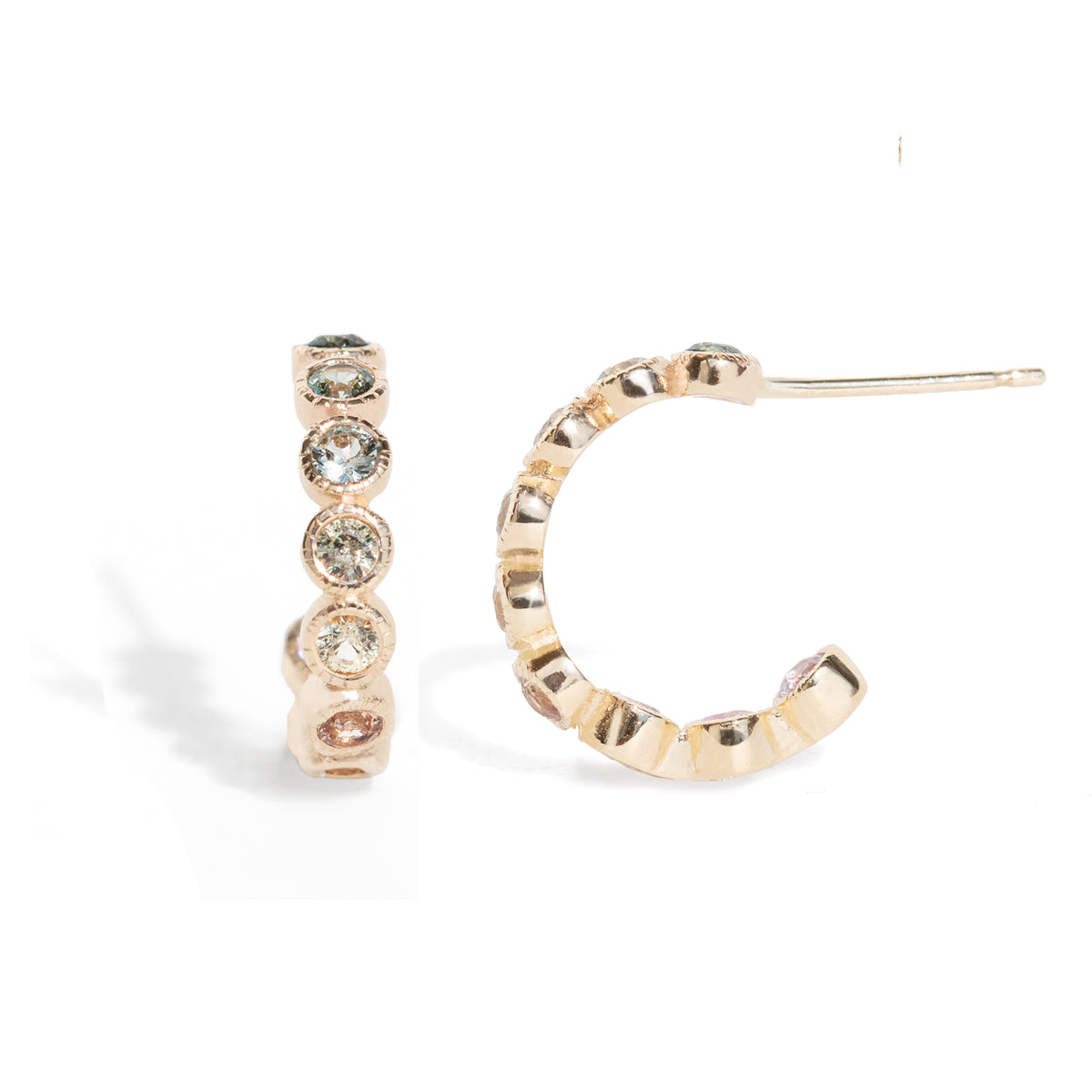 Gold hoop earrings with embedded stones on a white background