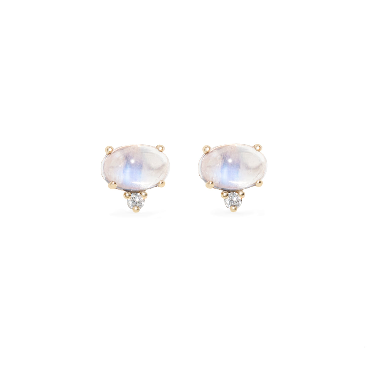Pair of oval-shaped with a white diamond earrings on a white background