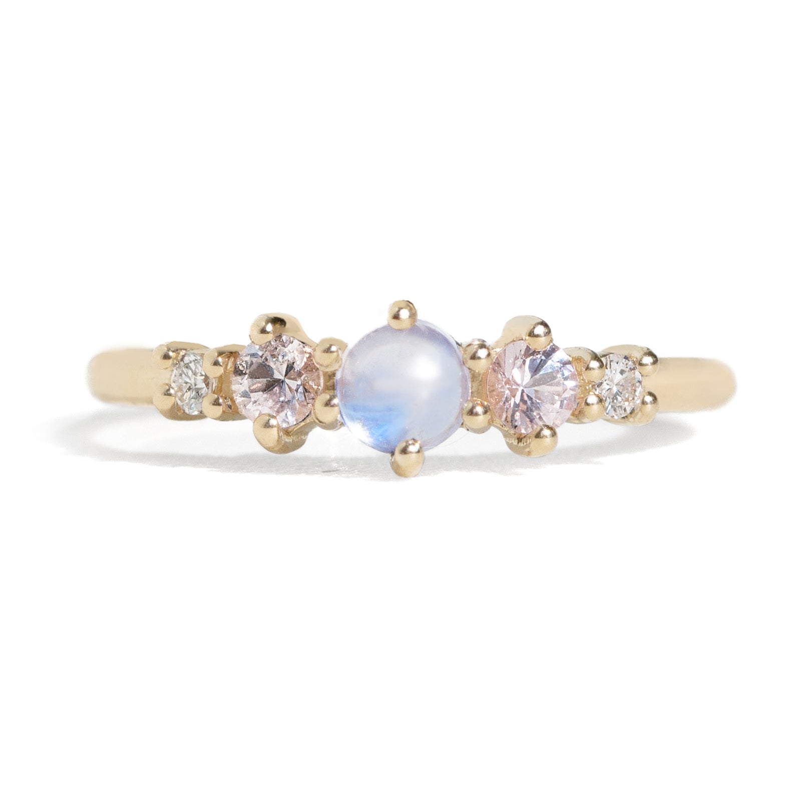 The classic Georgia design makes this five stone ring ideal for everyday wear. This unique ring features a round rainbow moonstone, adorned with natural pink sapphires and diamonds, and exudes mystical purple blue hues, making it a true unicorn piece.