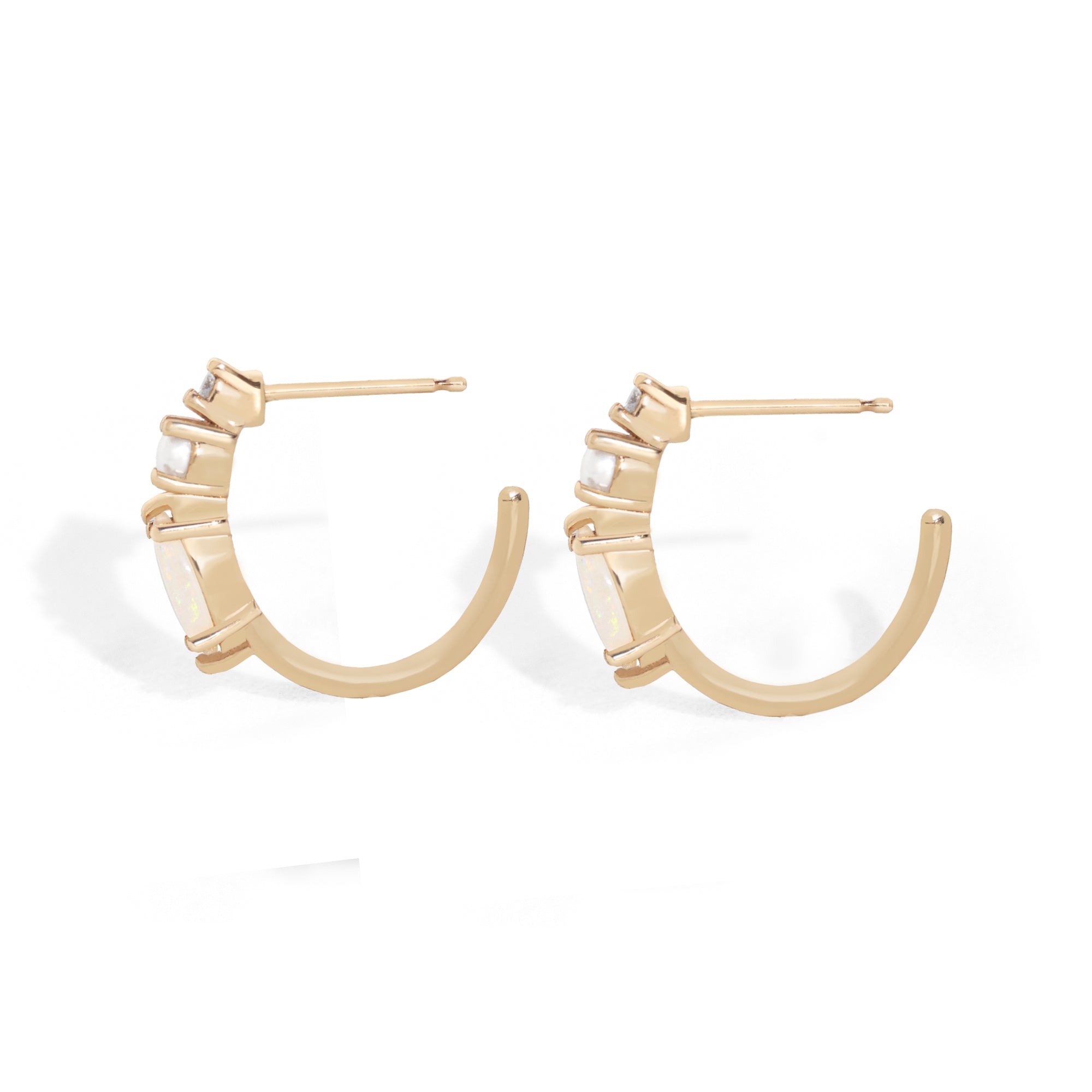 Inspired by our bestselling ring, these 14K gold hoops feature marquise-cut natural Australian opals, freshwater pearls, and natural diamonds – the perfect balance of uniqueness and simplicity for everyday wear. &nbsp;