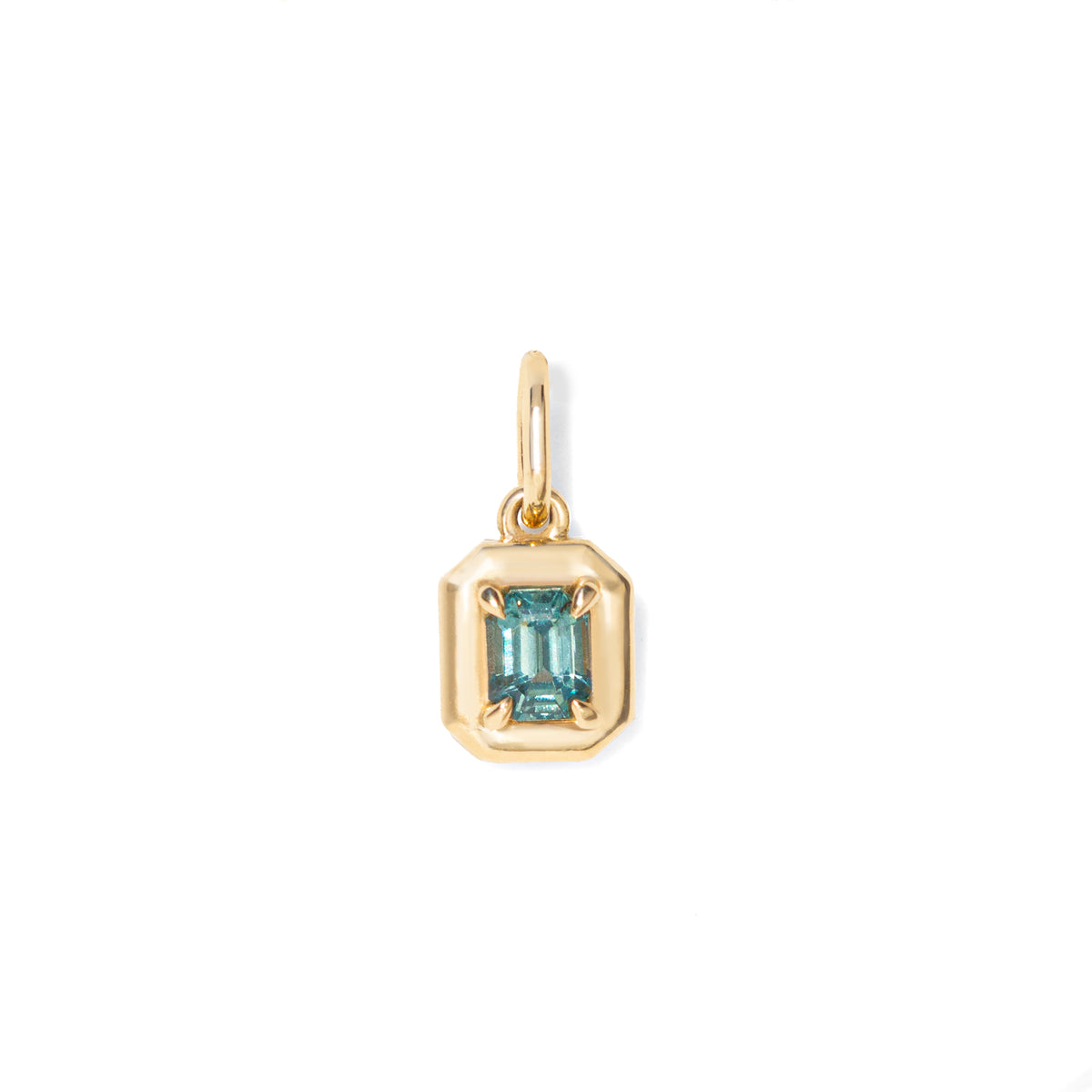 Gold necklace with a pendant featuring a blue green emerald cut sapphire on a white background