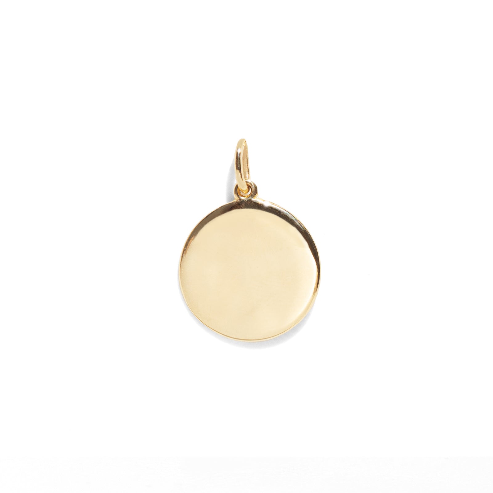 Gold pendant on a white background
