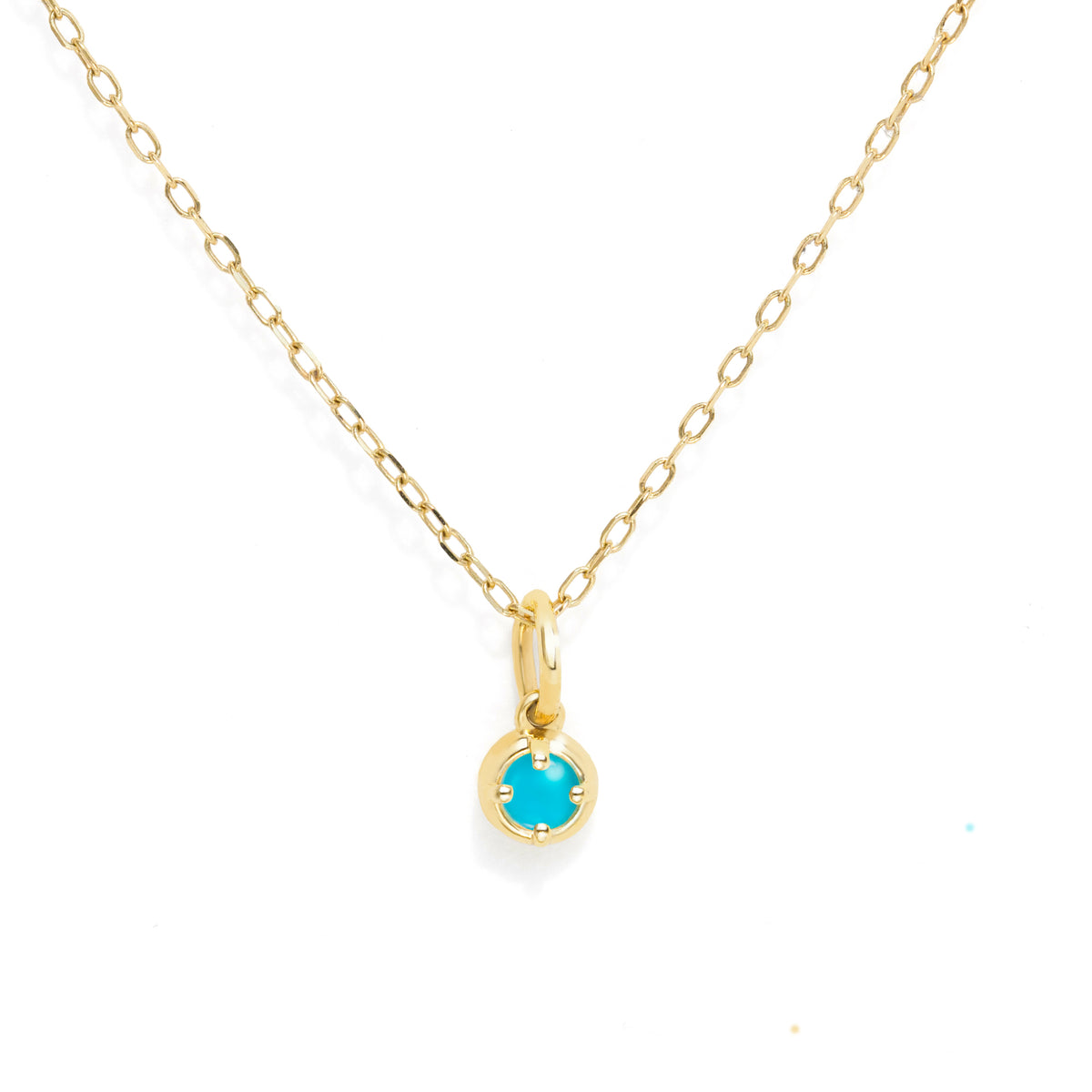 A delicate gold chain necklace with a small round bezel-set turquoise-blue gemstone pendant, displayed on a clean white background.