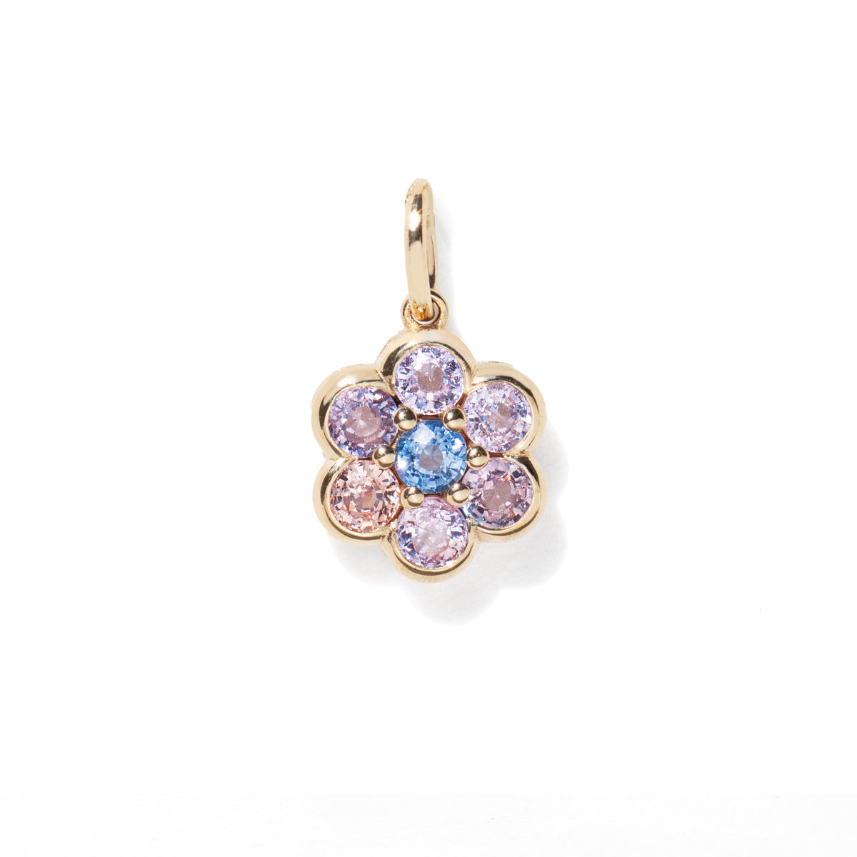 Gold pendant with multicolored gemstones on a white background