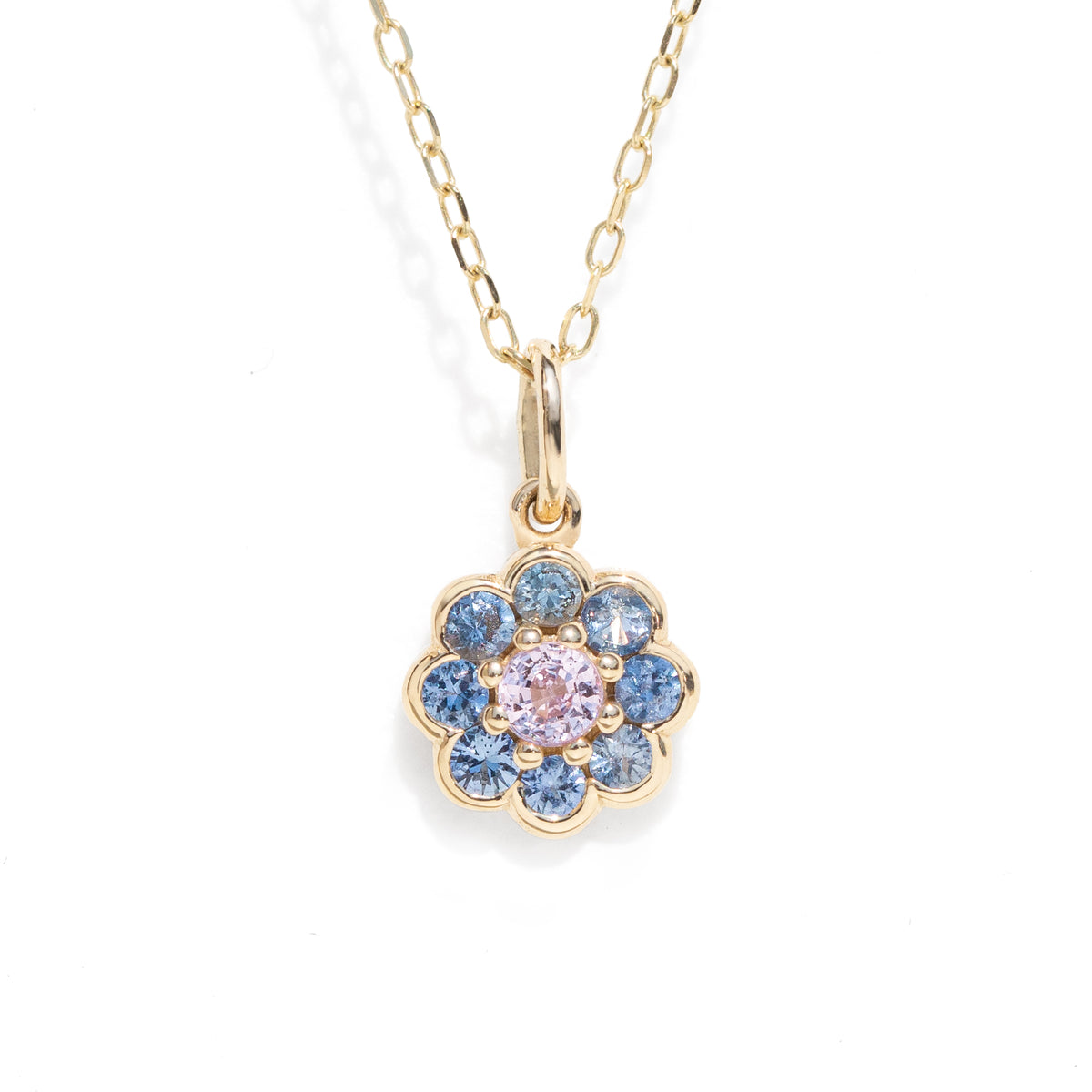 Pink and blue natural sapphire floral charm necklace pendant in gold.