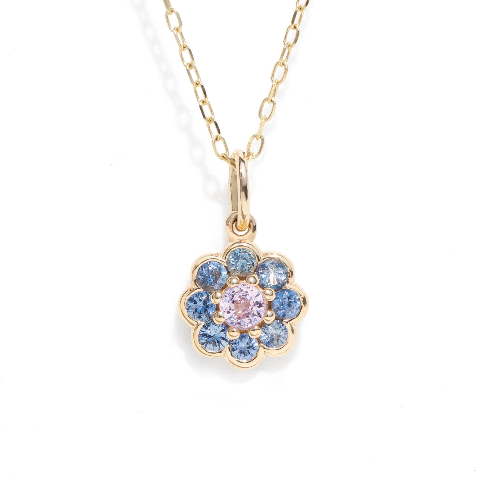 Pink and blue natural sapphire floral charm necklace pendant in gold.