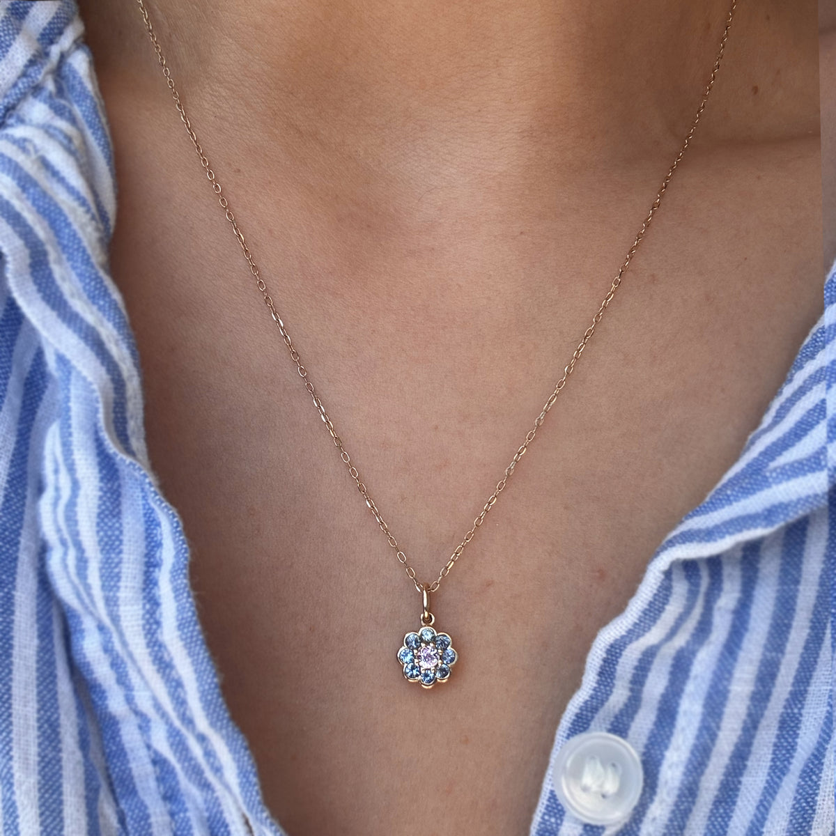 A gemstone necklace worn on a woman
