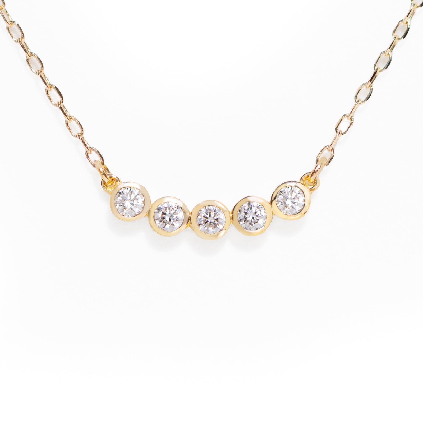 This customer's favorite Five Diamond Necklace is a go-to for any wardrobe. Effortlessly dressing up any look for the office, it can also be used to add a touch of sparkle for an evening out. Its sleek design makes it perfect for solo or layered styling. 16-18" adjustable size.