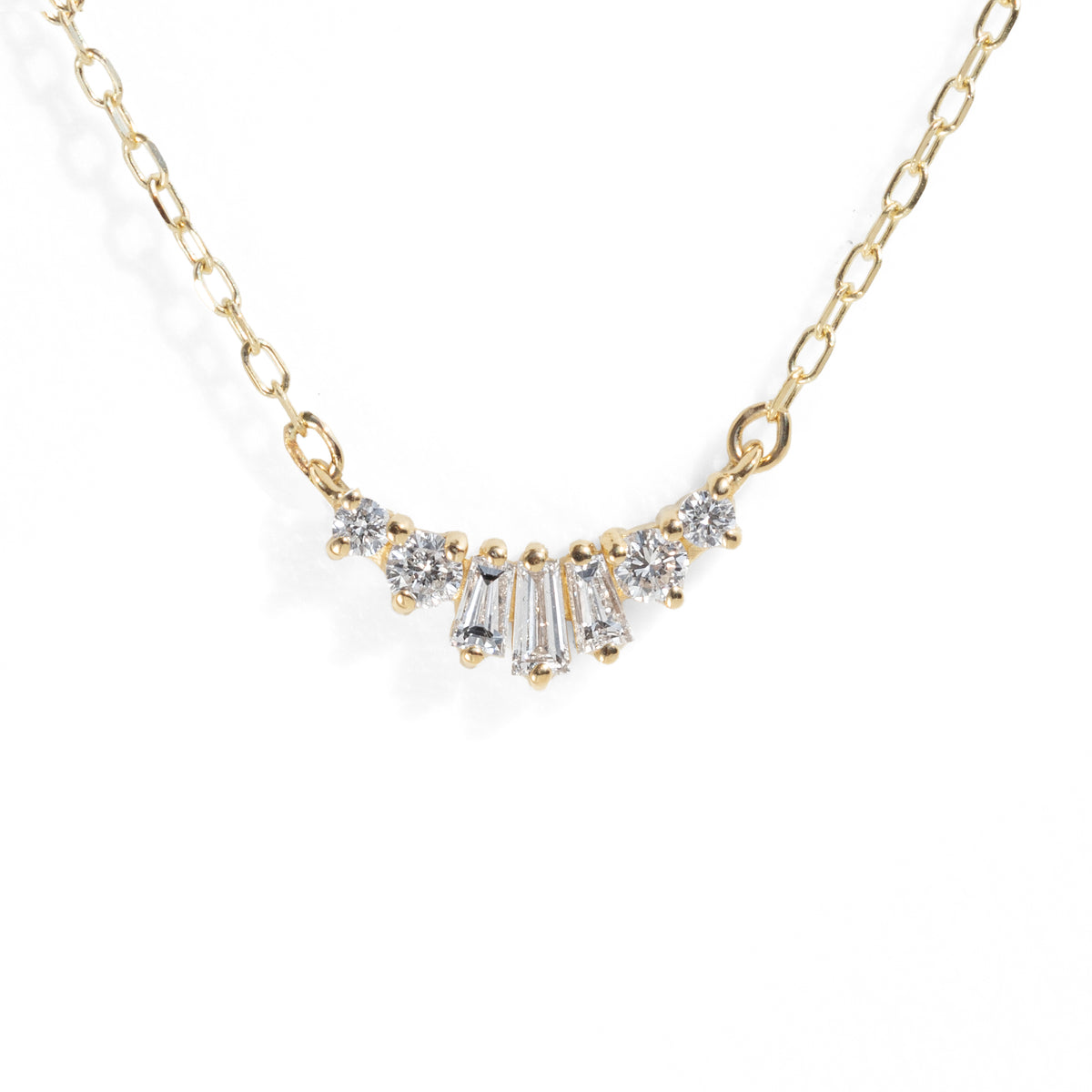 Gold necklace with diamond pendants on a white background