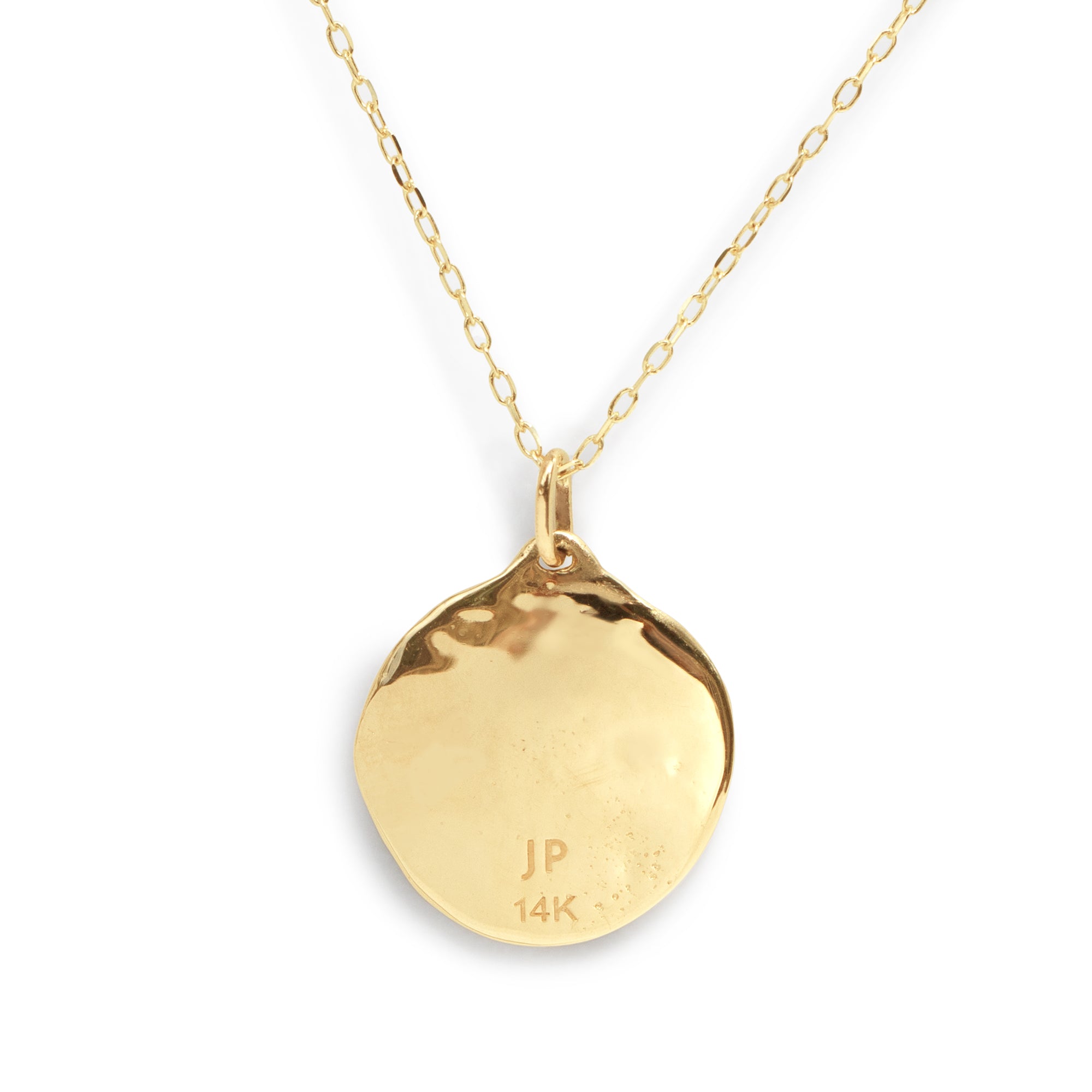The Three Star Necklace features a hand-forged 14K gold round charm, adorned with three starburst-set natural diamonds at its center. 