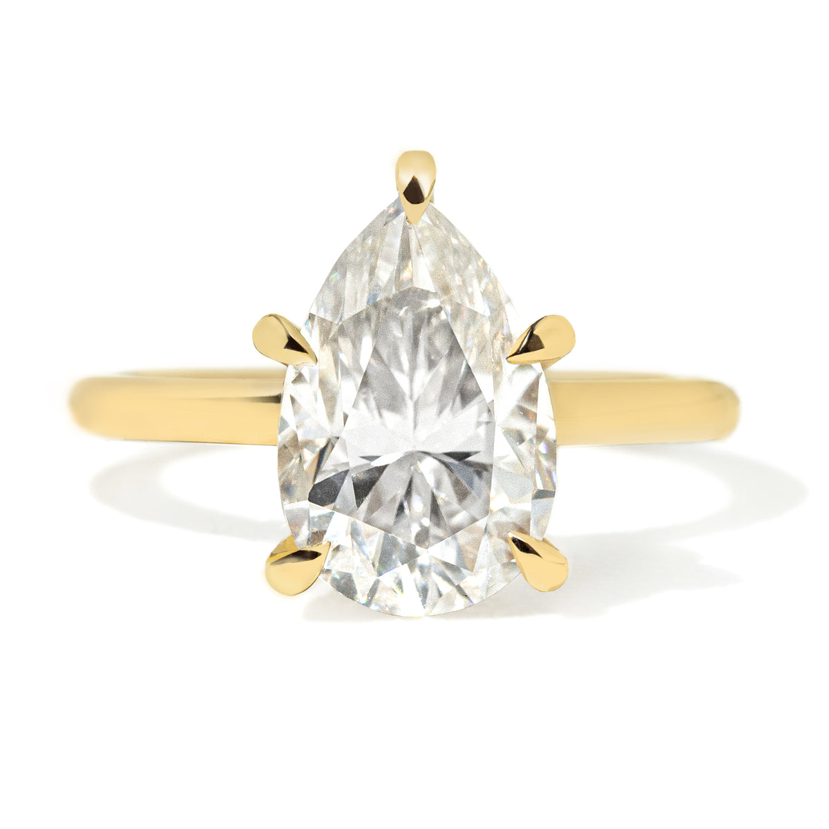 Jamie Park Jewelry | Sunshine Pear Cut Ring The Sunshine Pear Cut Solitaire Ring beautifully blends modern style with elegance. Available with lab white sapphire, moissanite, or IGI certified diamond, this ring is sure to sparkle and impress. The five-prong design ensures the center stone is securely held. The size shown is 2.5ct.