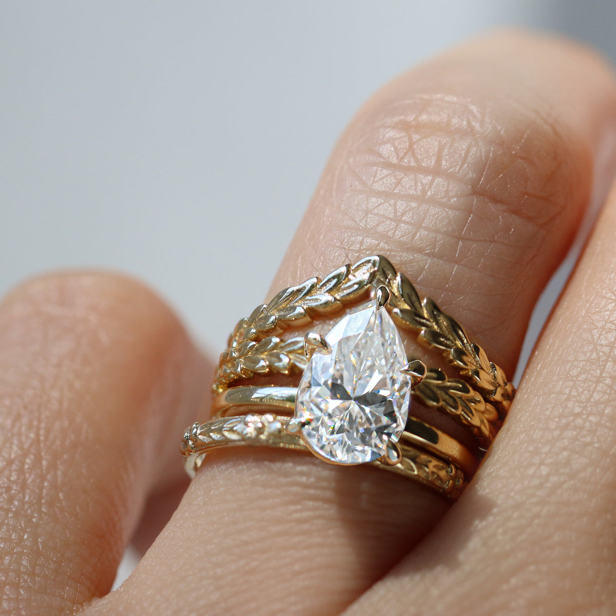 Jamie Park Jewelry | Sunshine Pear Cut Ring The Sunshine Pear Cut Solitaire Ring beautifully blends modern style with elegance. Available with lab white sapphire, moissanite, or IGI certified diamond, this ring is sure to sparkle and impress. The five-prong design ensures the center stone is securely held. The size shown is 2.5ct.