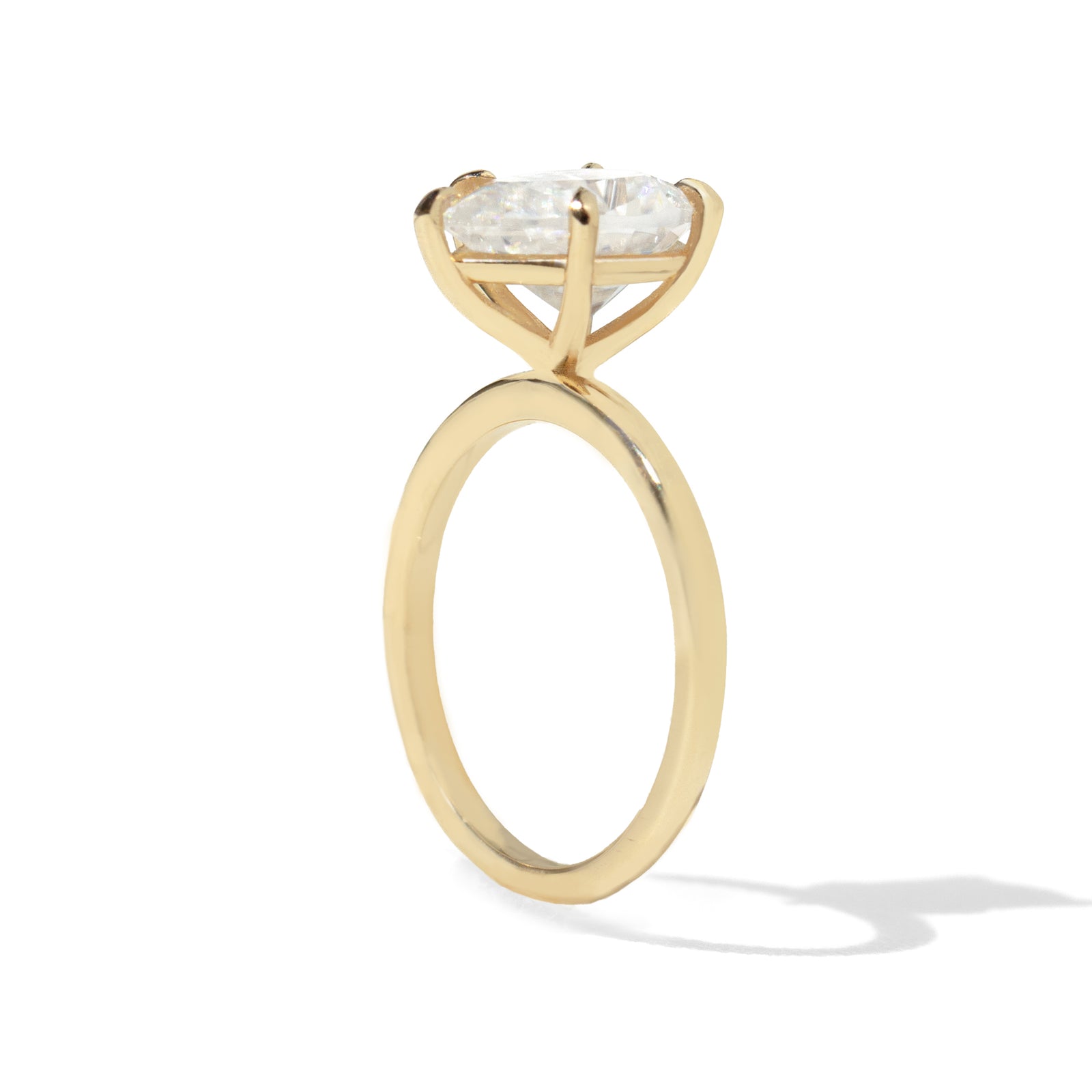 Jamie Park Jewelry | Sunshine Pear Cut Ring The Sunshine Pear Cut Solitaire Ring beautifully blends modern style with elegance. Available with lab white sapphire, moissanite, or IGI certified diamond, this ring is sure to sparkle and impress. The five-prong design ensures the center stone is securely held. The size shown is 2.5ct.