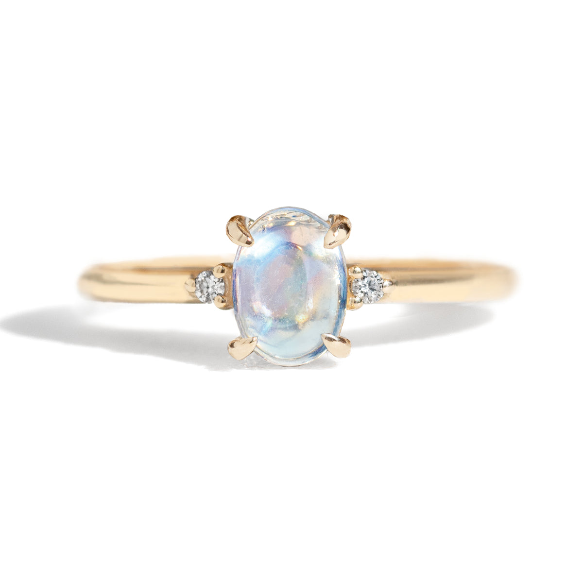 The classic Grace Ring&#39;s three stone design makes it perfect for your special day. This unique ring features an oval rainbow moonstone adorned with small diamonds, making it a truly one-of-a-kind piece. Pair this ring with Blossom Moonstone Contour Band to create your dream ring stack.&amp;nbsp;