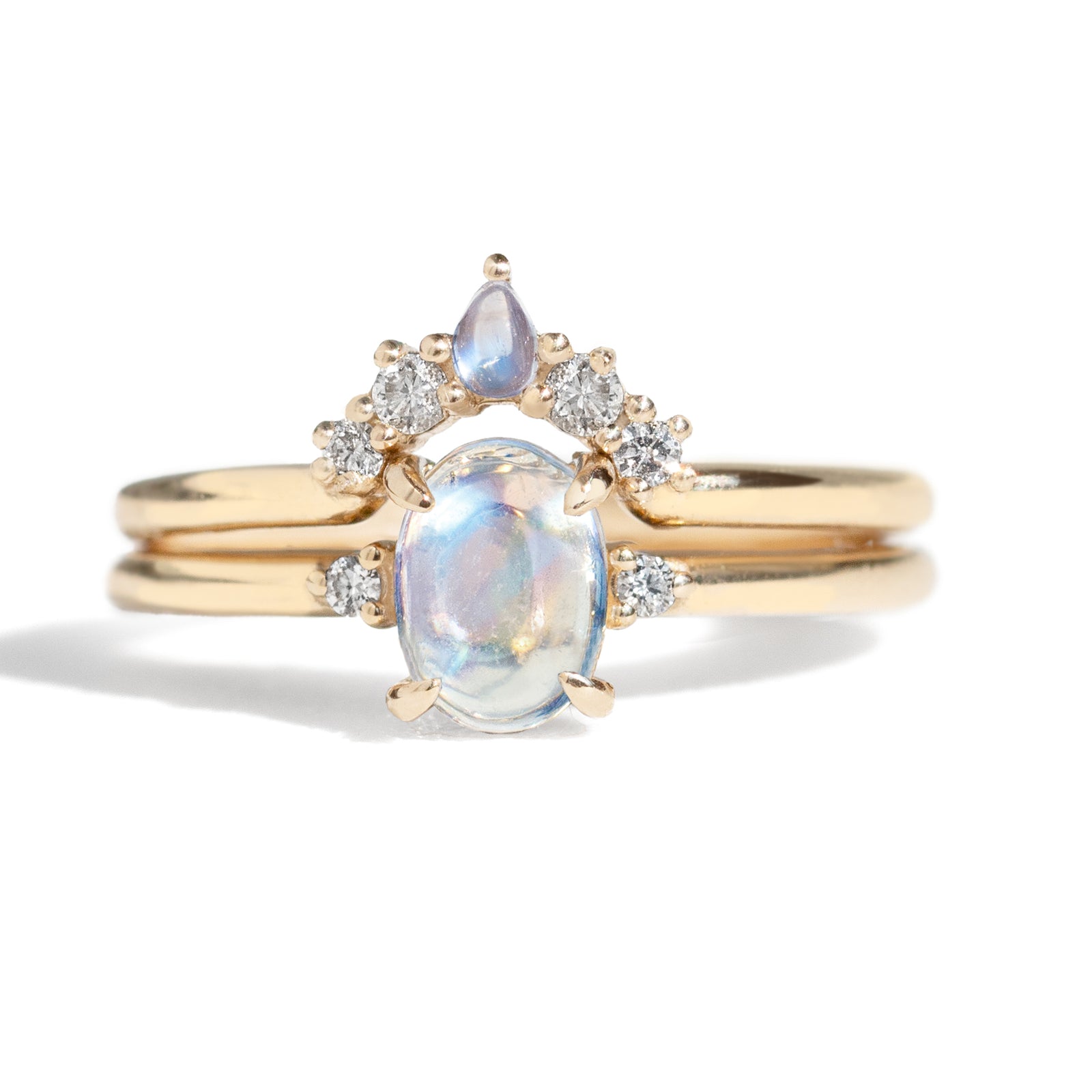 The classic Grace Ring's three stone design makes it perfect for your special day. This unique ring features an oval rainbow moonstone adorned with small diamonds, making it a truly one-of-a-kind piece. Pair this ring with Blossom Moonstone Contour Band to create your dream ring stack.&nbsp;