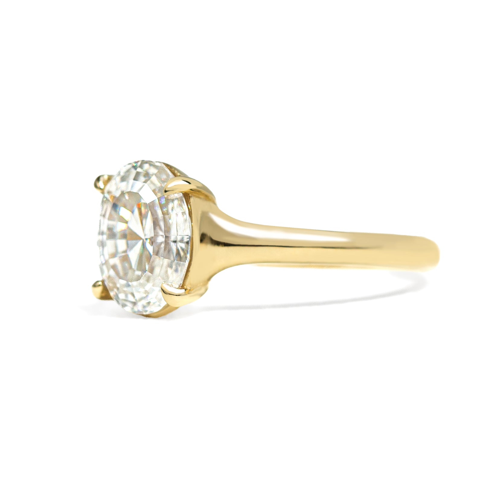 Oval step cut 2ct diamond ring on white background 
