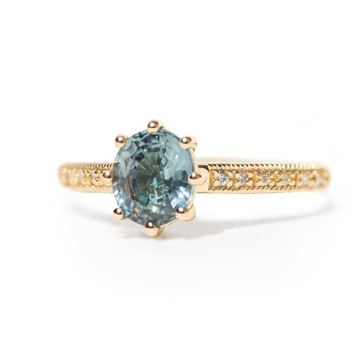 The 1.3ct. Oval Montana Sapphire Audrey Ring features a rich blue-green Montana sapphire on a band with delicate milgrain detailing. The elegant 8-prong design securely holds your stone, adding a unique touch. This ring is perfect for those who love timeless and intricate design.&amp;nbsp;