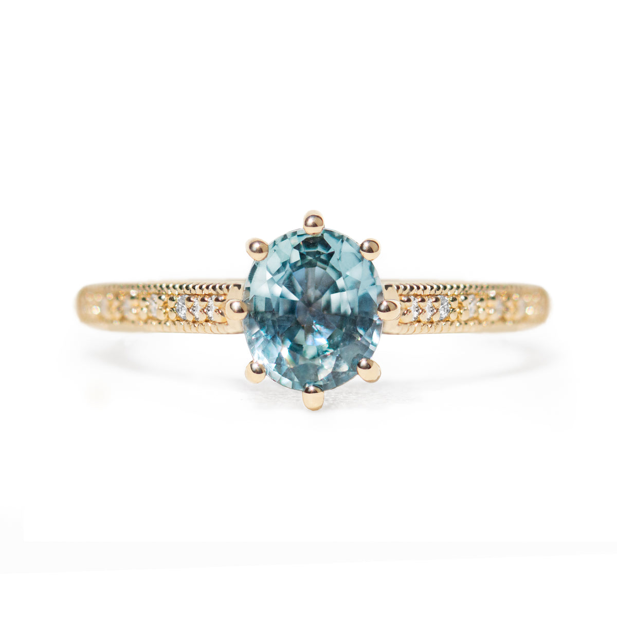 The 1.3ct. Oval Montana Sapphire Audrey Ring features a rich blue-green Montana sapphire on a band with delicate milgrain detailing. The elegant 8-prong design securely holds your stone, adding a unique touch. This ring is perfect for those who love timeless and intricate design.&amp;nbsp;