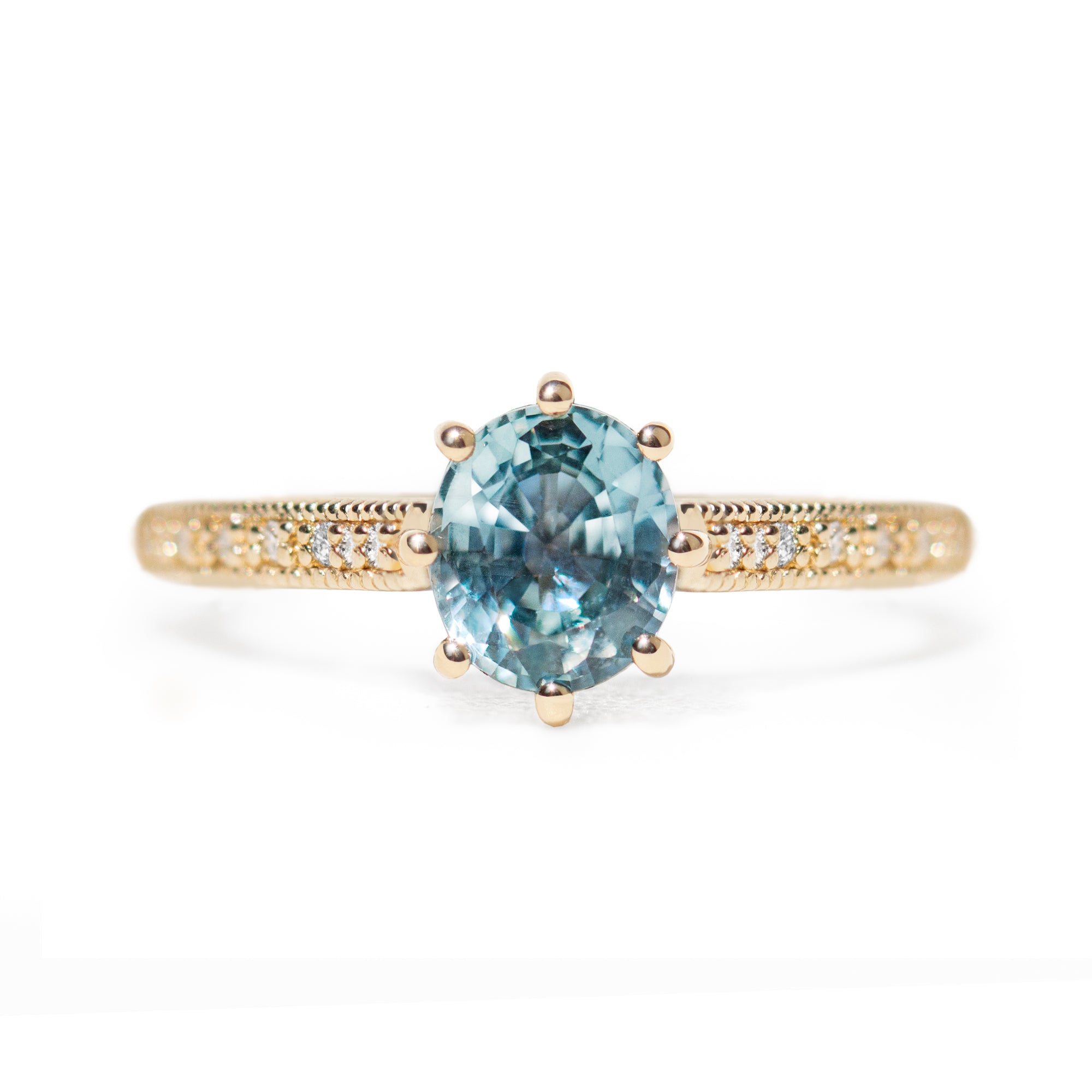 The 1.3ct. Oval Montana Sapphire Audrey Ring features a rich blue-green Montana sapphire on a band with delicate milgrain detailing. The elegant 8-prong design securely holds your stone, adding a unique touch. This ring is perfect for those who love timeless and intricate design.&nbsp;