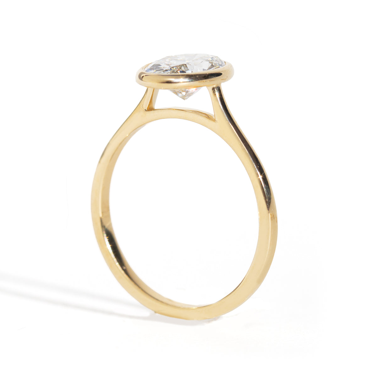 Oval Diamond Ring in gold  on a white background