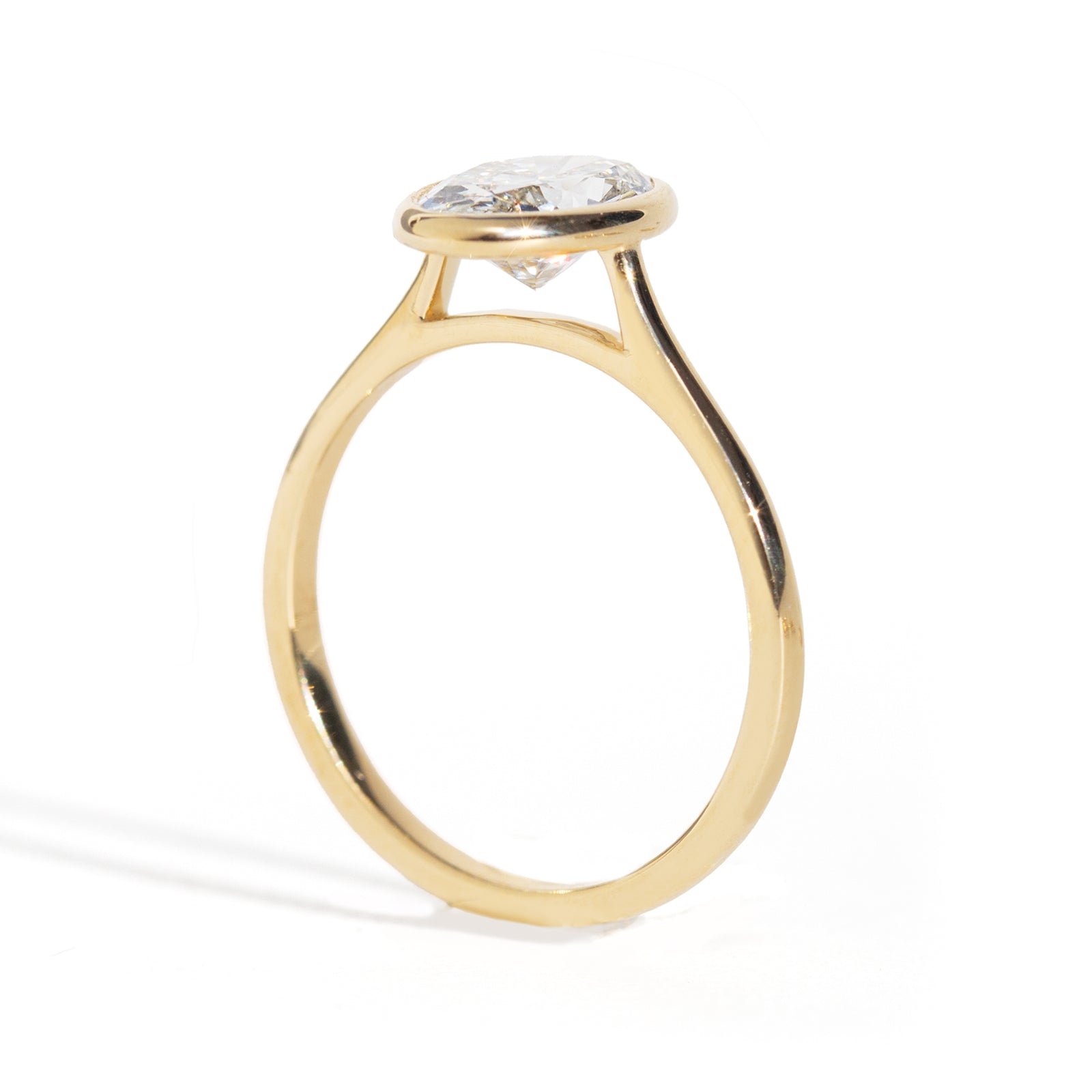 Oval Diamond Ring in gold  on a white background