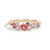 Gold ring with pink and red gemstones on a white background