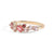 Gold ring with pink gemstones on a white background