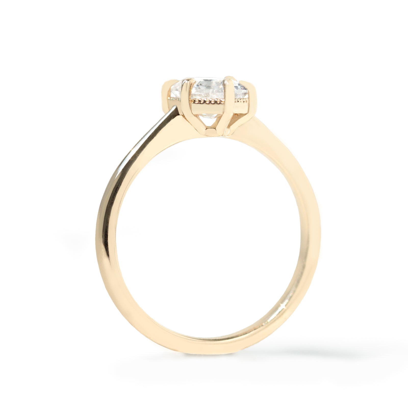 The Hera Ring showcases a 1.5ct hexagon lab diamond or moissanite, with a delicately highlighted hexagon step cut and milgrain accents on the setting. This elegant and romantic ring effortlessly combines antique charm with a modern aesthetic. It serves as the perfect choice for engagements, milestone celebrations, birthdays, and anniversaries, making it a versatile and timeless piece.