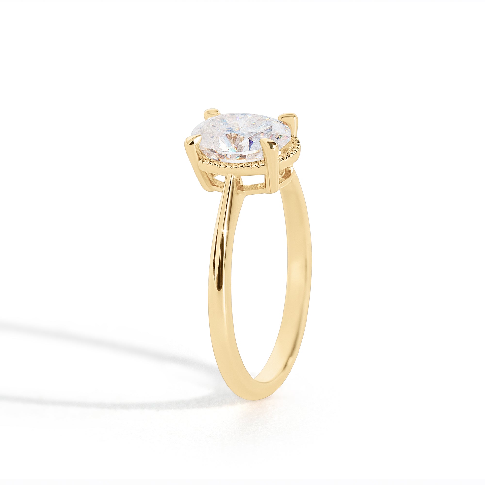 The Hera Ring features a 1ct. oval diamond or moissanite set in a delicately milgrained setting. This elegant and romantic design effortlessly blends old-world charm with a modern aesthetic. It’s the perfect choice for engagements, milestone celebrations, birthdays, and anniversaries, making it a timeless piece.