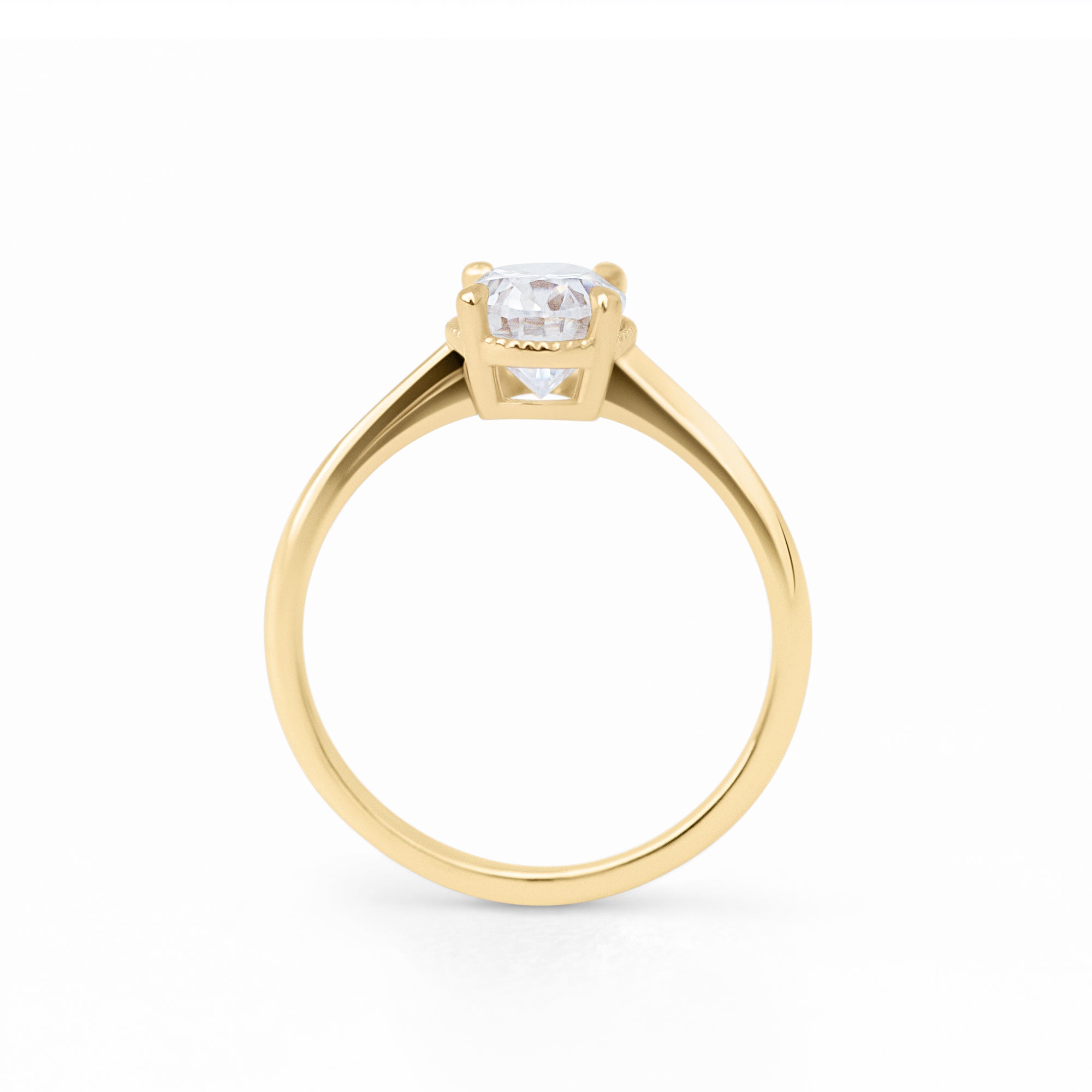 The Hera Ring features a 1ct. oval diamond or moissanite set in a delicately milgrained setting. This elegant and romantic design effortlessly blends old-world charm with a modern aesthetic. It’s the perfect choice for engagements, milestone celebrations, birthdays, and anniversaries, making it a timeless piece.