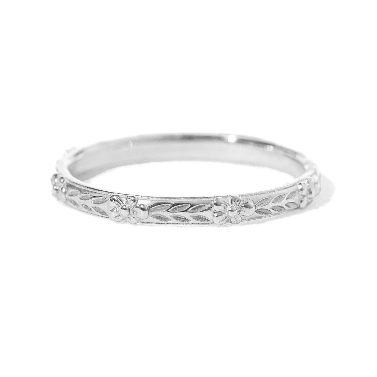 Jamie Park Jewelry - Flower Market Band Add effortless elegance to your everyday style with the Flower Market Band. The intricate vintage inspired pattern exudes sophistication, making it a perfect choice for both casual and formal occasions. Elevate your look with this beautiful and versatile piece, perfect as a standalone band or as a complement to your engagement ring or wedding band. Edit alt text